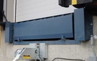 Steel face dock bumper with Dock Leveler and AR-20K Trailer Restraint