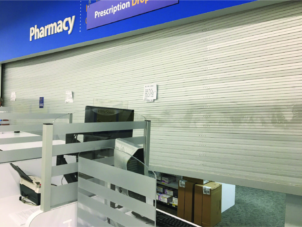 Stuck rolling pharmacy doors security shutters at Walmart Barrie