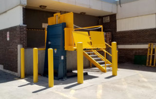 Platform lift for receiving dock with bollards