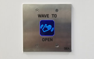 wave sensor actuator for touchless entry