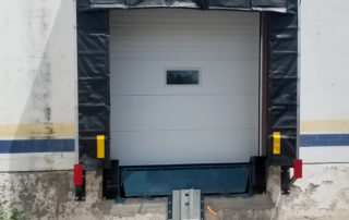 Completed new loading dock position from outside with dock shelter, restraint and bumpers