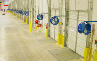 High velocity cooling fan truck cooler mount in loading dock