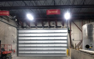 Large steel sectional overhead door hubberts inside