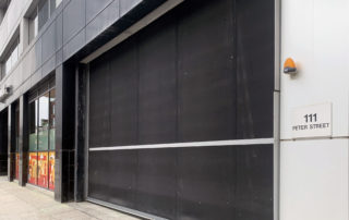Low Headroom Parking Garage Door - Crown Property Management Door - After