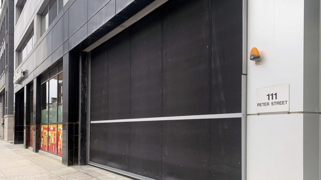 Low Headroom Parking Garage Door - Crown Property Management Door - After