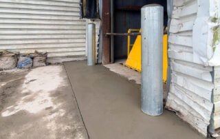 after new bollards and concrete apron