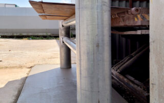 Galvanized pour-in pipe bollards in grocery store in London