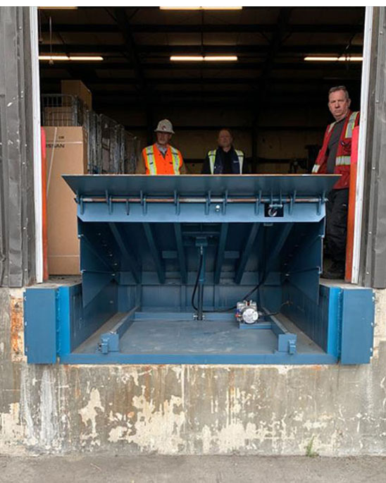 Hydraulic Dock Leveler Burnaby-Open Heavy-Duty Hydraulic Dock Leveler and Steel Face Dock Bumpers in raised position in burnaby