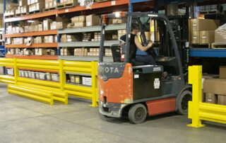 Steel Guardrail Systems warehouse guarding railing lifts out rails with forklift driving through