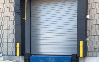 Whitby warehouse blue giant rotating hook trailer restraint truck lock vehicle HVR303 hydraulic dock leveler laminate dock bumpers adjustable head curtain dock seal 200