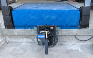 Whitby warehouse blue giant rotating hook trailer restraint truck lock vehicle HVR303 hydraulic dock leveler laminate dock bumpers