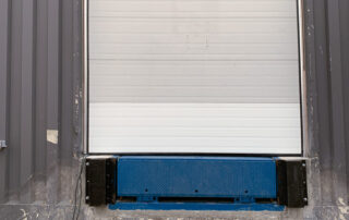 after overhead section door replacement, loading dock leveler plate, steel face dock bumpers calgary alberta