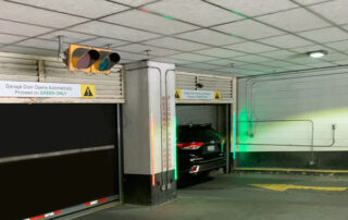 Garage door rubber doors with LED red/green lite advance door monitoring lights, door is fully open so light is green and car can proceed