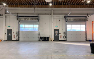 after inside view two polycarbonate section windows for overhead doors, LZR widescan motion presence sensor and berner industrial air curtain