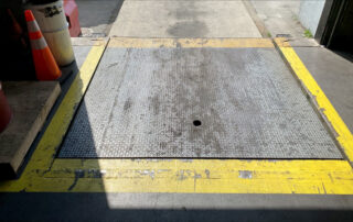 before replacement hydraulic dock leveler burnaby BC warehouse inside dock lowered