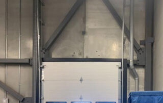 Before Calgary Farmers' Market inside steel section overhead door with windows