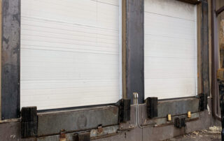 Removed corrugated wall paneling mounting dock seals construction Calgary Farmers' Market