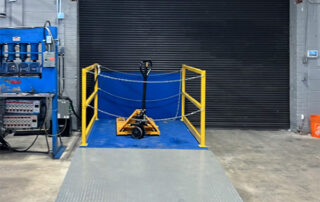 Blue Giant dock lift with custom ramp for manual pallet trucks