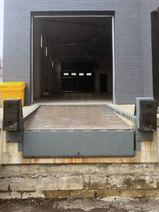 Etobicoke warehouse Before Rusted and worn exterior dock leveler