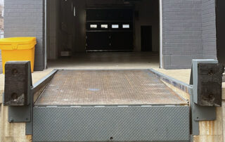 Etobicoke warehouse Before Rusted and worn exterior dock leveler