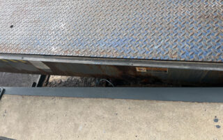 Etobicoke warehouse Before Rusted and worn exterior dock leveler