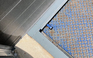 Etobicoke warehouse Before Rusted and worn exterior dock leveler rear curb angle weather seal