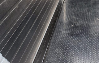 Etobicoke warehouse After New Blue Giant heavy-duty Hydraulic Dock Leveler workhorse rust resistant powder coated black rubber dock weather seal stripping rear curb angle