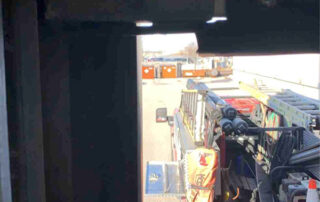 overhead dock sectional door preventive maintenance PMP Before - Position 1 – Dock Door - Damaged bottom weather seal.