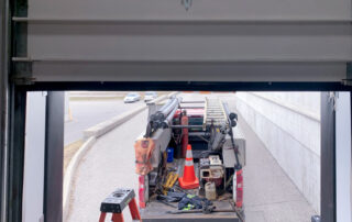overhead dock sectional door preventive maintenance PMP After - Position 1 – Dock Door - Supplied and installed new bottom rubber weather seal