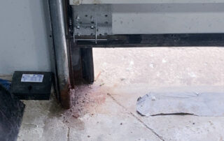 overhead dock sectional door preventive maintenance PMP After - Position 2 – Drive-In Door - New bottom brackets installed
