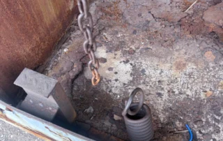 Root Cause Discovery Dock 13 Lip lock chain disconnected. Damper spring missing.
